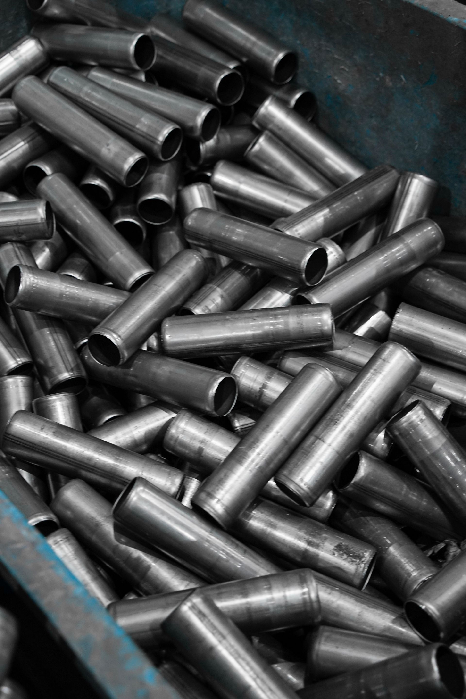 Bin of raw steel tube materials